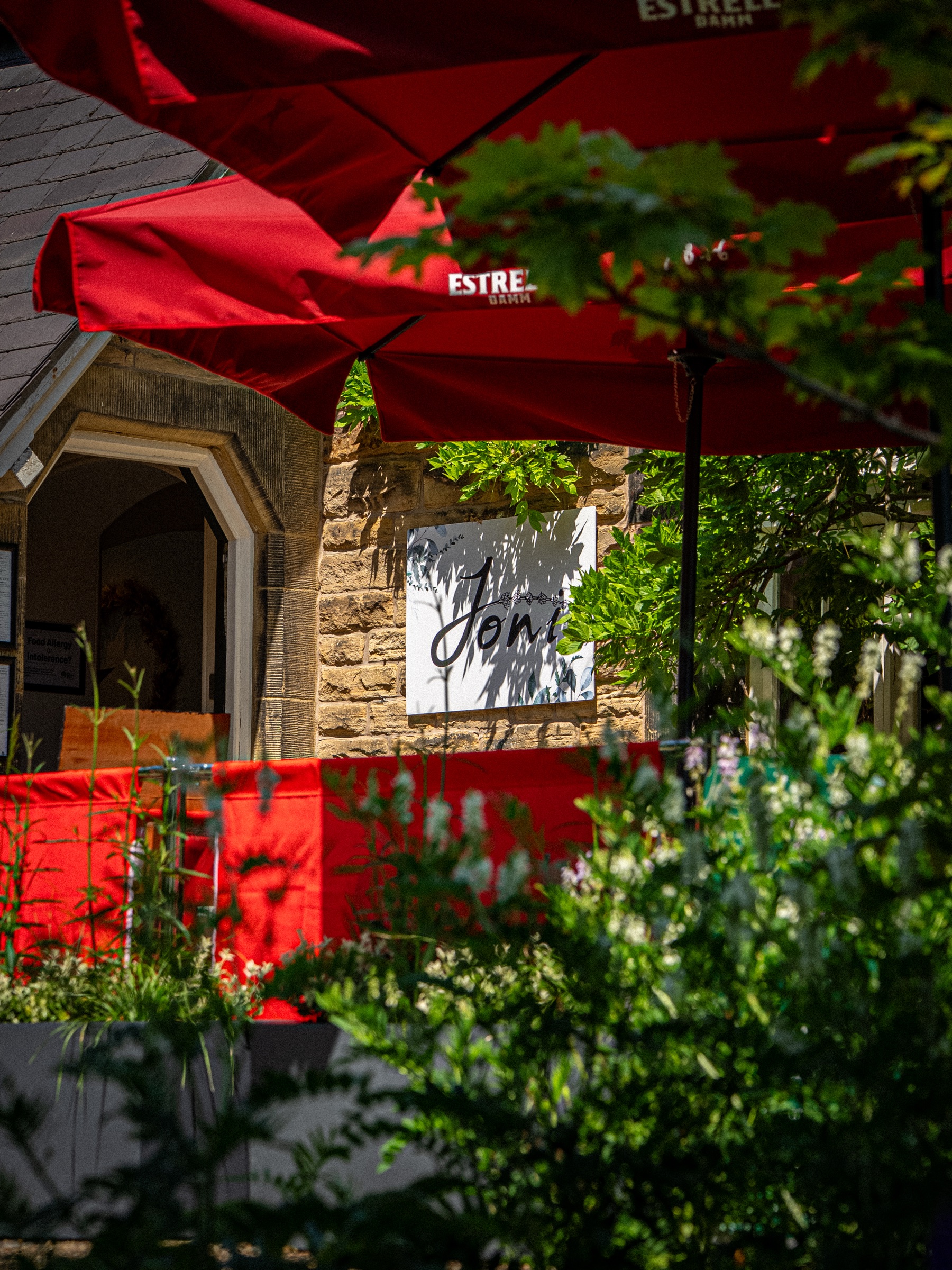 Joni signage on the stone café building